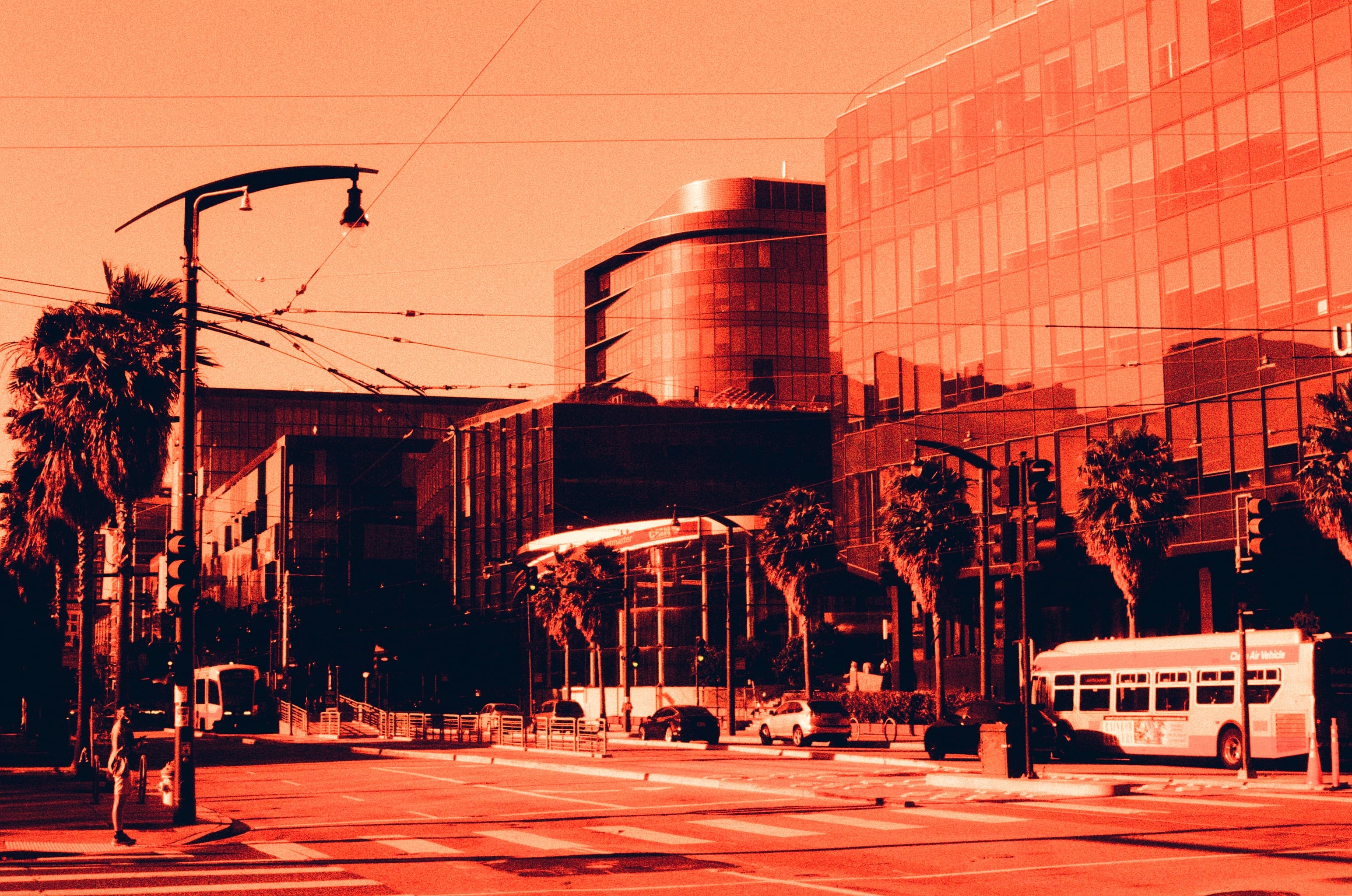 Mission Bay architecture, palm trees, and transit in red